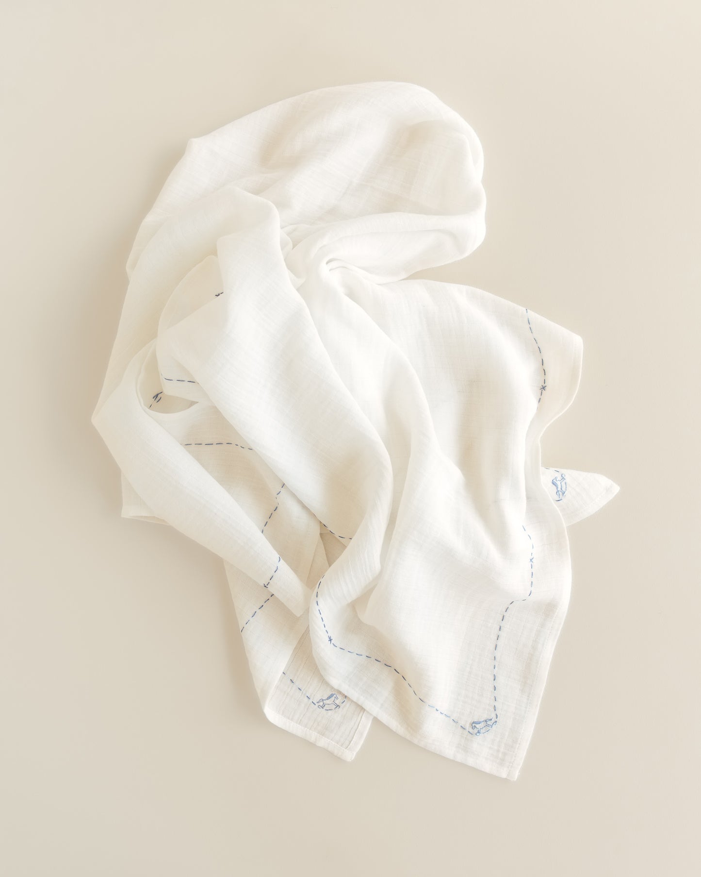embroidered swaddle - rocking horse